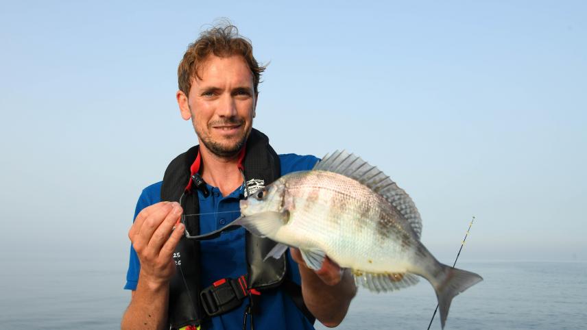 Guillaume Fourrier with a sea bream, photo by Stéphanie PERON, Paris Normandie