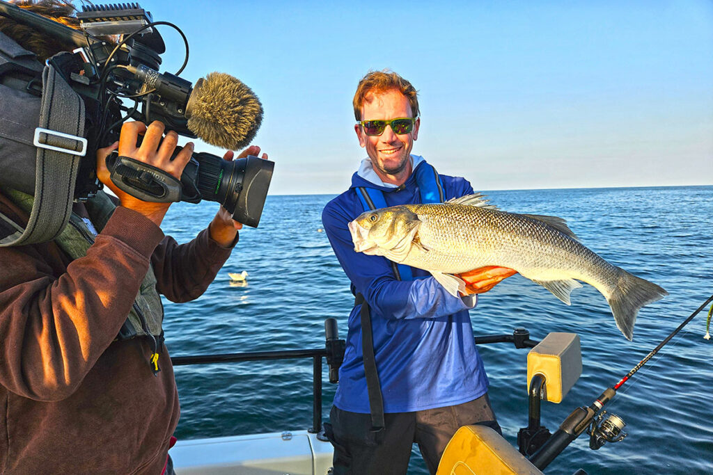 Guillaume captures a large seabass on a soft lure.