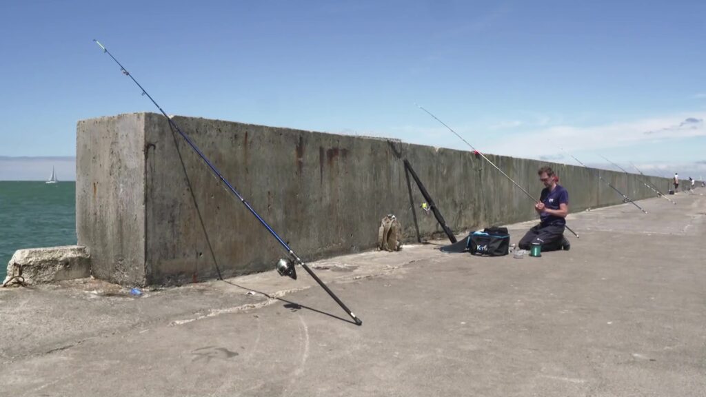 Guillaume fishing from the Carnot breakwater in Boulogne-sur-Mer